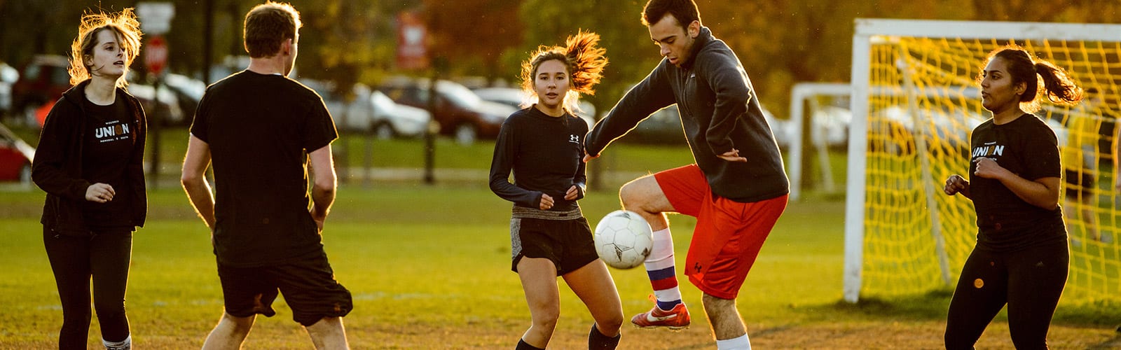 Students playing soccer
