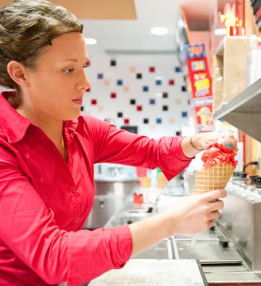 A student serving ice cream at the Babcock Dairy Store