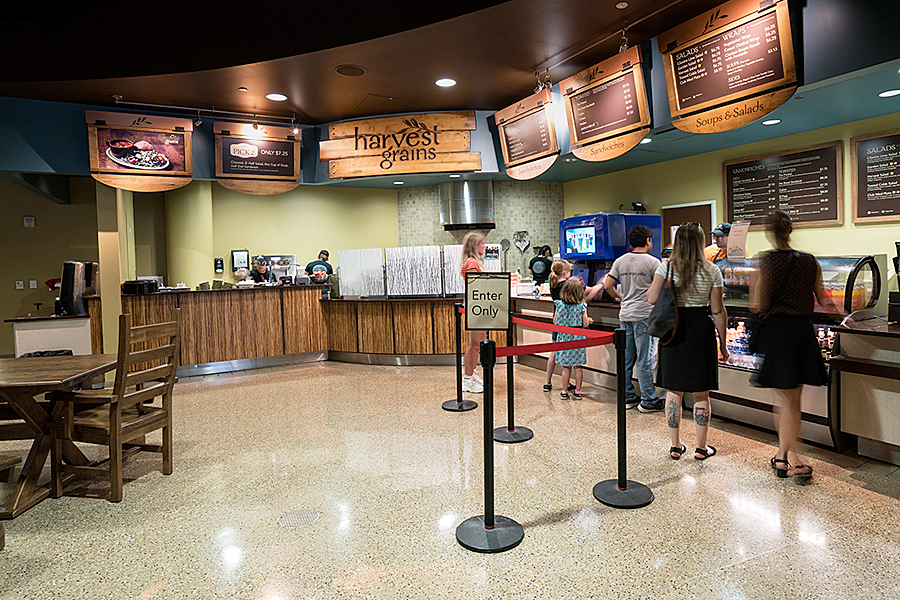 People standing in line ordering food at Harvest Grains.