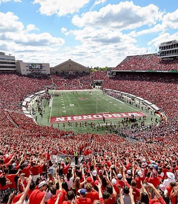 Camp Randall stadium full of red-wearing Badgers fans