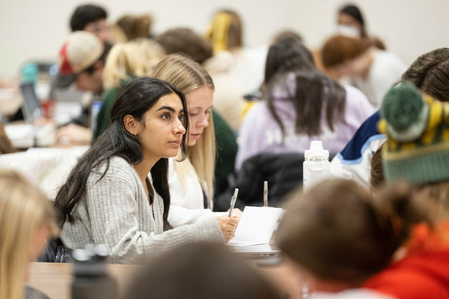 Students take notes in a Journalism course in Vilas Hall.