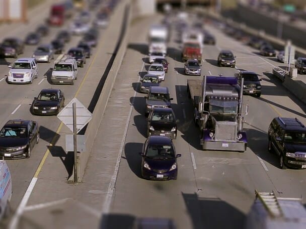 Overhead view of dozens of vehicles on a highway