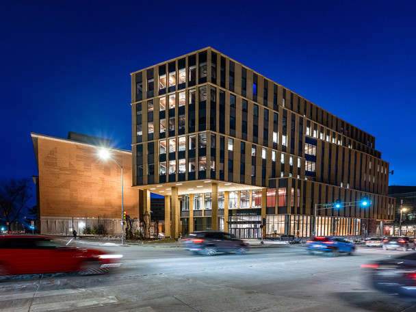 An exterior photo of Morgridge Hall, taken at dusk.