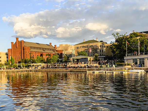 The Memorial Union Terrace as seen from Lake Mendota on a summer day, late in the afternoon.