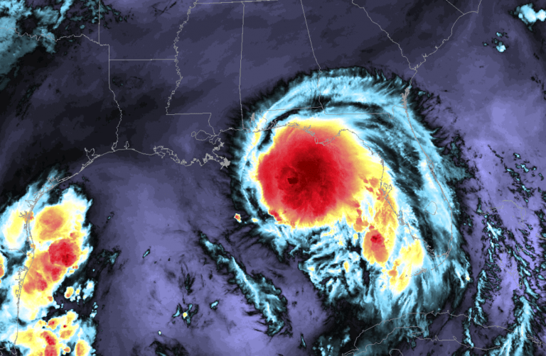A satellite image of a hurricane making landfall off the eastern coast of Florida