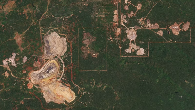 A satellite image shows the overhead landscape of the Democratic Republic of the Congo.