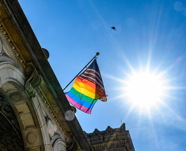 Pride and US flags flying over UW–Madison Memorial Union